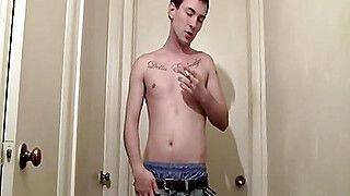 Inked smoker twink wanking in hallway - gayxo.com