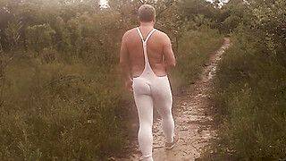 Outside in nature, bulging in a sexy Tendenze bodysuit - gayxo.com